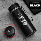 Black smart water bottle showing the temperature on its LED screen.


