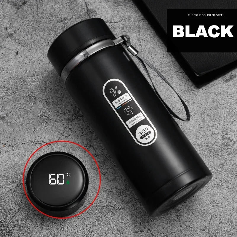 Black smart water bottle showing the temperature on its LED screen.

